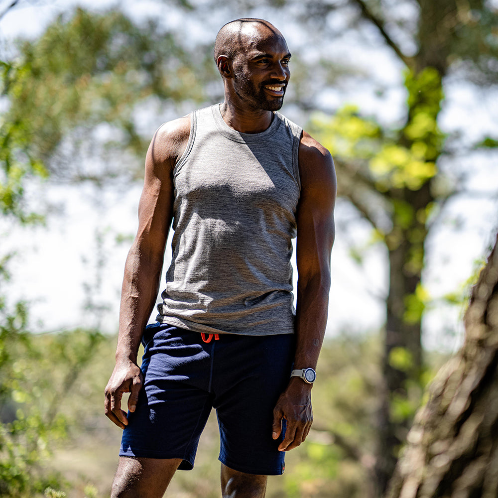 Isobaa | Mens Merino 150 Vest (Charcoal) | Be ready for any adventure with Isobaa's superfine Merino sleeveless Vest. | Model: Michael