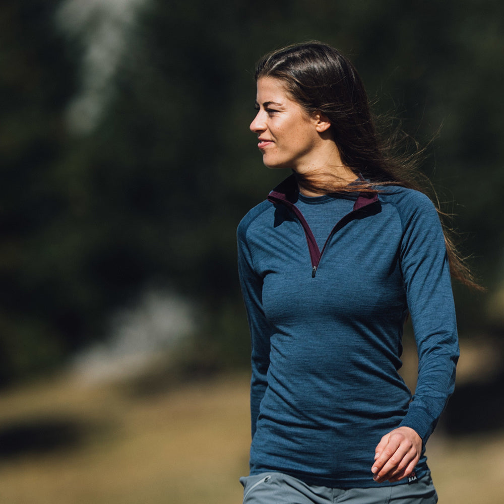 Isobaa | Womens Merino 200 Long Sleeve Zip Neck (Denim) | Experience the best of 200gm Merino wool with this ultimate half-zip top – your go-to for challenging hikes, chilly bike commutes, post-workout layering, and unpredictable weather. | Model: Jess
