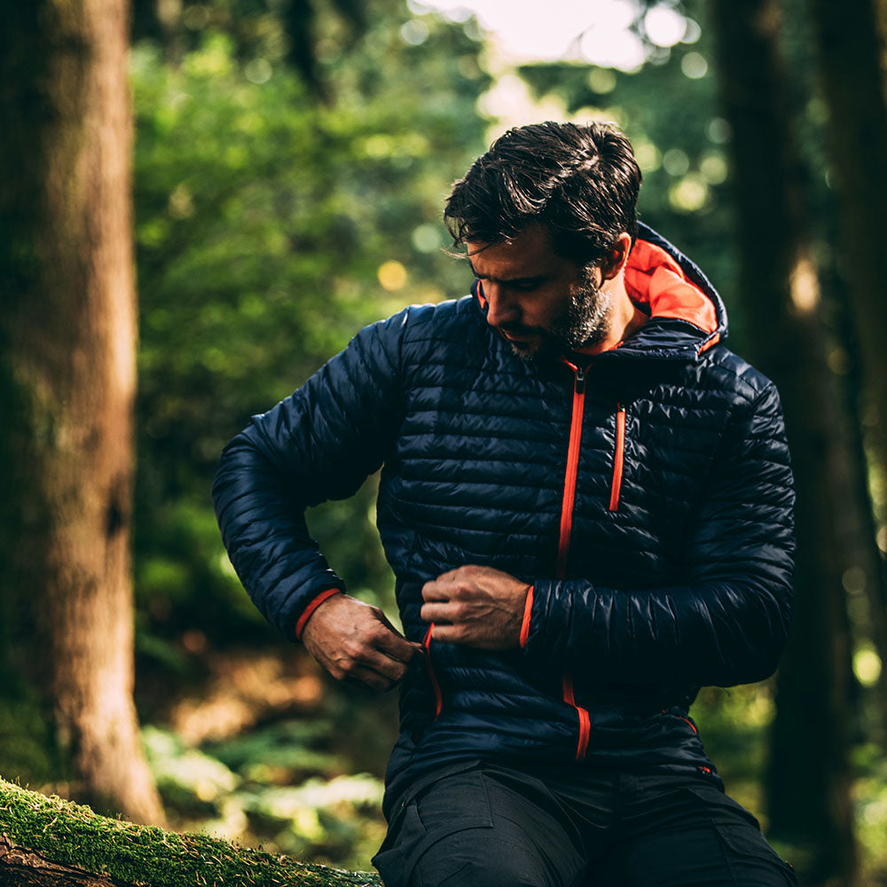 Isobaa | Mens Merino Wool Insulated Jacket (Navy/Orange) | Innovative and sustainable design with our Merino jacket. | Model: Duncan