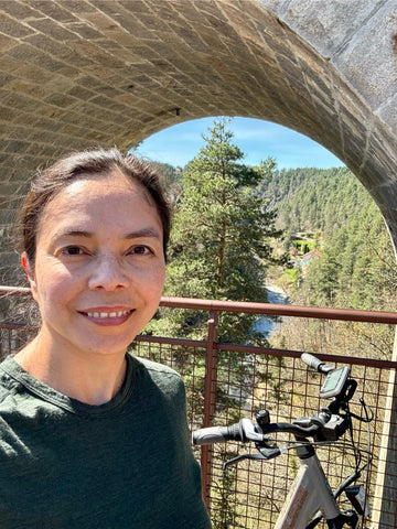 Catherine wearing her womens merino 180 long sleeve crew (forest)