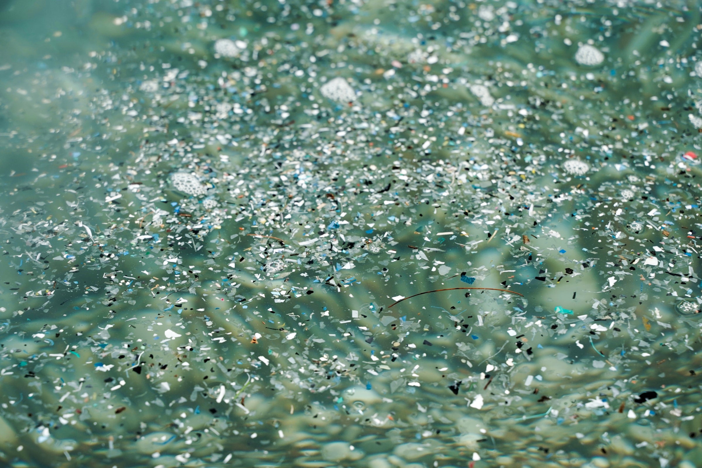Microplastic pollution floating in water