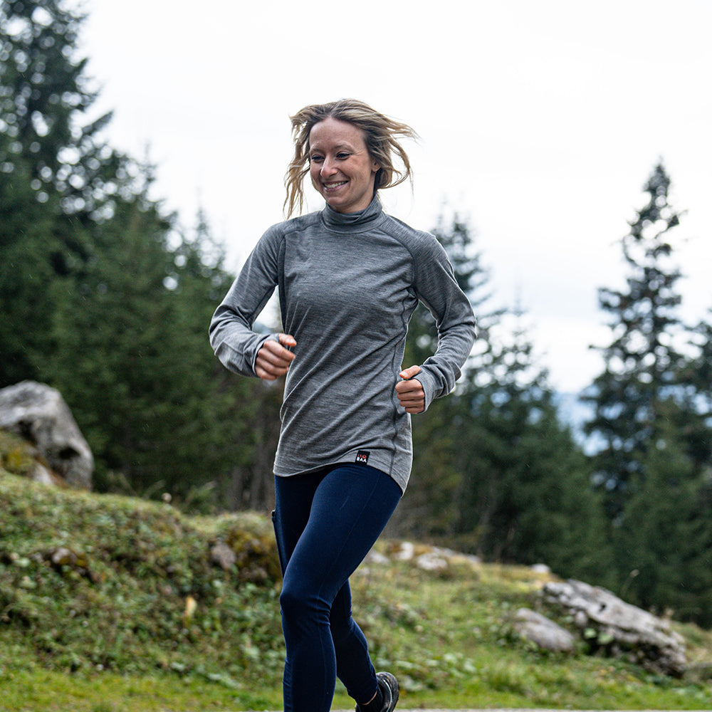 Isobaa | Womens 160 Merino Active Roll Neck (Charcoal Melange) | Embrace the chill in style with our Women's 160 Merino Active Roll Neck, crafted from 160g 18.5 micron superfine merino wool | Model: Estelle