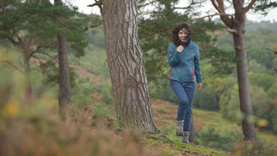 Isobaa | Womens Packable Insulated Jacket (Petrol/Orange) | Exceptional warmth, packable convenience, and sustainable design with our lightweight Merino wool jacket. | align: 75% 40% | Model: Clémentine