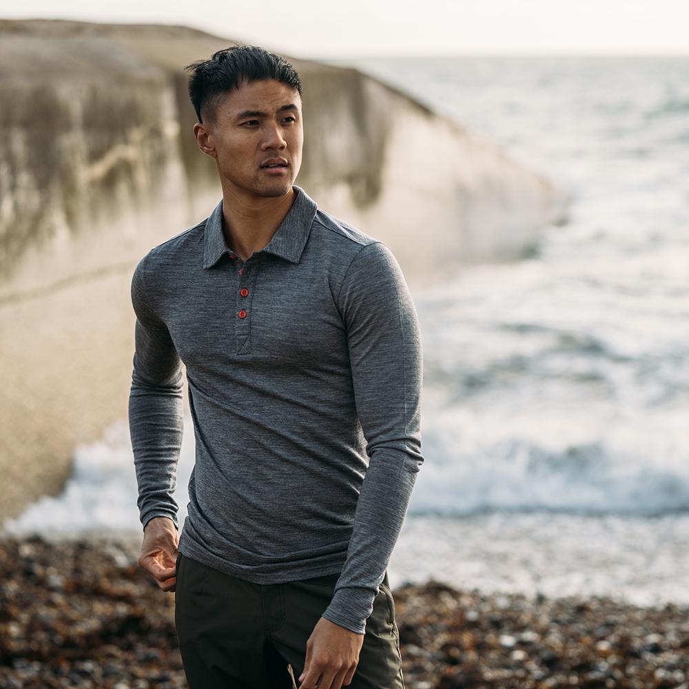 Isobaa | Mens Merino 200 Long Sleeve Polo Shirt (Charcoal/Orange) | Discover unmatched comfort with our 200gm Merino wool polo. | Model: Donald